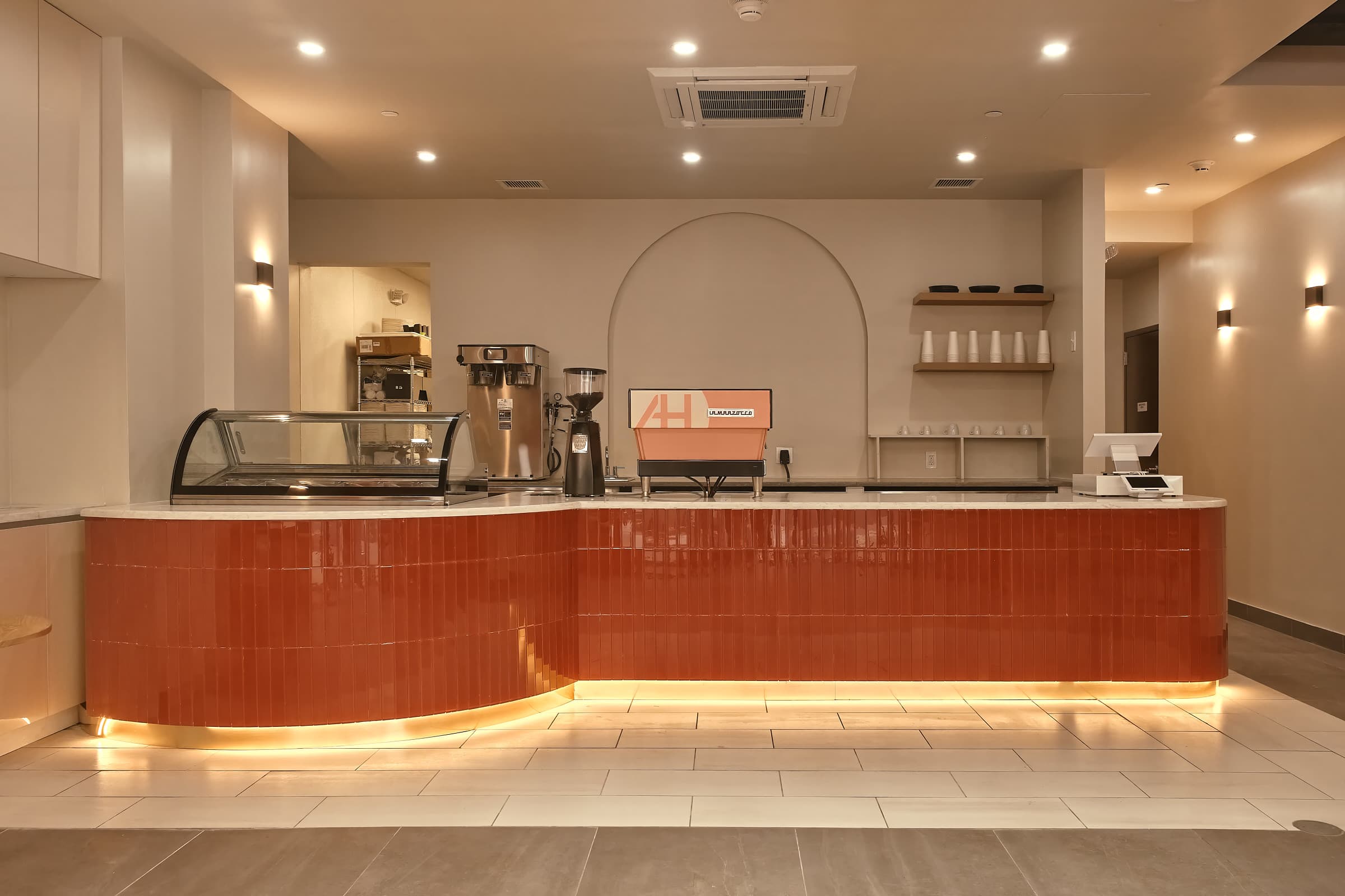 Indoor view of cafe with tables and chairs